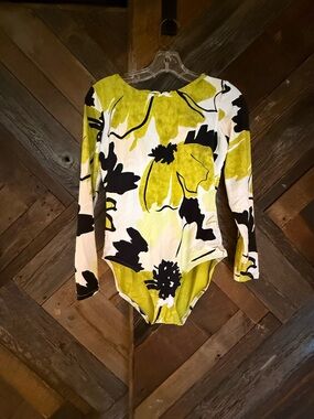 Calia long sleeve bathing suit with open back. Size 6. New.